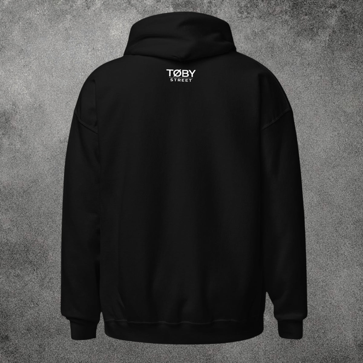 Sudadera con capucha negra unisex TØBY STREET vista trasera con logo blanco en la nuca y tejido de mezcla suave
